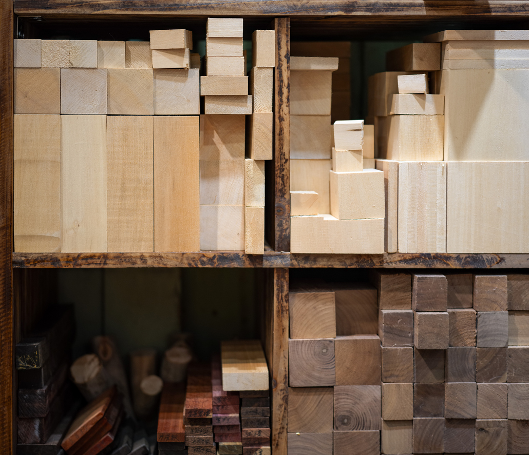 Various types of timber stacked in the woodworking shop